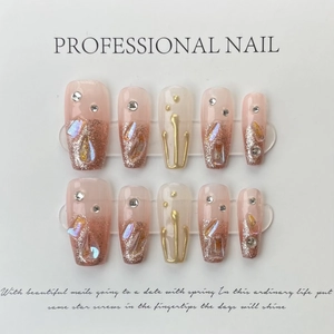 Handmade ombre pink press-on nails with rose gold glitter, 3D gold lines, and crystals