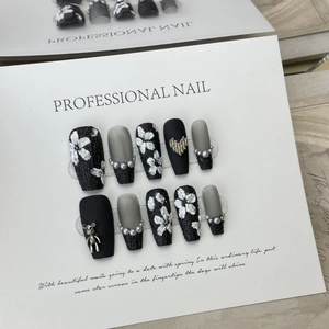 Handmade black and grey press-on nails with 3D floral tweed texture and pearl charms