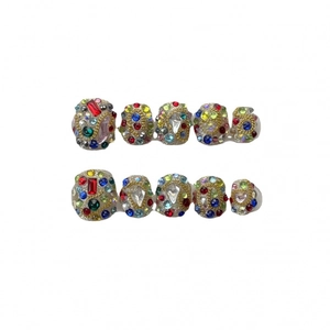 Handmade press-on nails with colorful rhinestones and gold chain details on 10 piece set