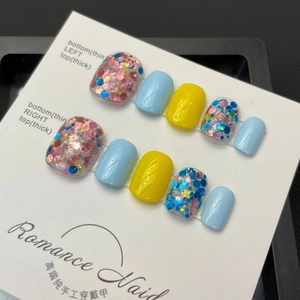 Handmade press-on nails set with blue and yellow colors and colorful chunky glitters