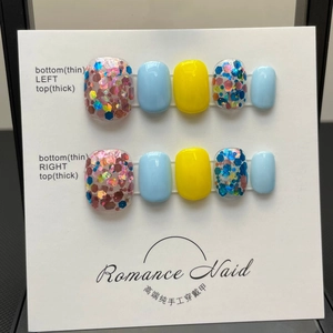 Handmade press-on nails set with bright yellow, light blue, and colorful glitter sequins