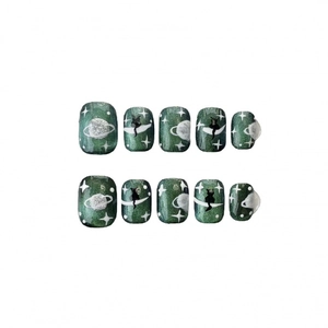 Handmade green cat eye press-on nails with cute hand-painted starry sky and cat patterns