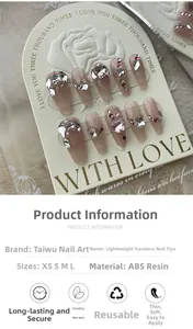 Macro view of nude pink cat-eye press-on nails with heart gems and pearls detail