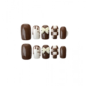 Brown checkerboard handmade press-on nails with 3D white bows and chocolate drip design