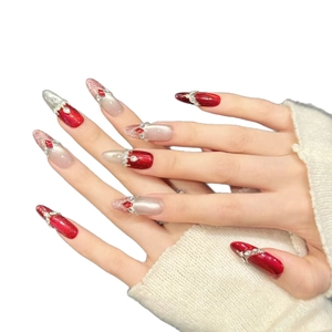 Red cat-eye press-on nails with silver glitter gradients and 3D rhinestone embellishments