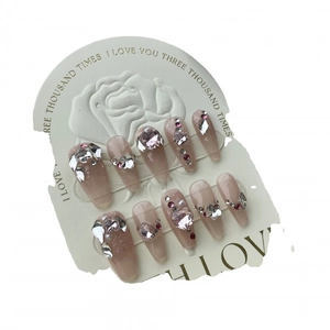 Sparkly pink long coffin press-on nails with 3D crystal hearts and rhinestone gems