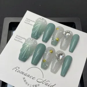 Handmade ocean shell press-on nails with green glitter, 3D textures, pearls and heart charms