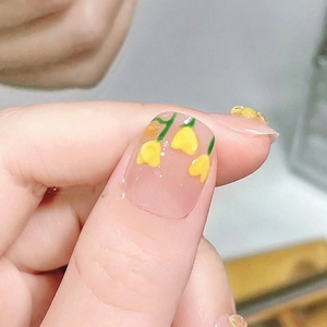 Handmade nude pink press-on nails with 3D yellow tulip and floral nail art design