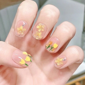 Handmade sheer pink press-on nails with 3D yellow tulip flower designs and glitter
