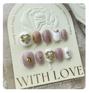 Detailed set of 10 handmade press-on nails with leopard print and pearl heart charms