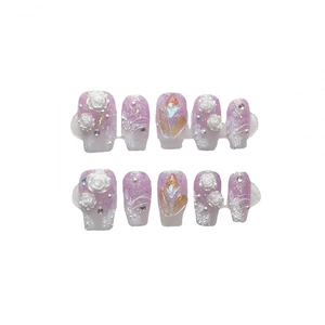 Handmade light purple press-on nails with 3D white rose carvings and sparkling rhinestones
