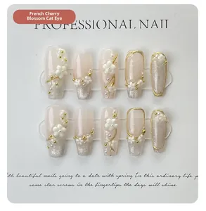 Detail showing 3D floral relief and cherry blossom cat-eye press-on nails set of 10