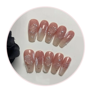 Detailed view of 10-piece handmade pink gradient press-on nails with 3D rose and pearls