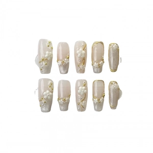 Handmade press-on nails with pink cat eye base, 3D floral accents and silver glitter tips