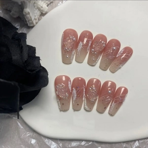Handmade gradient pink press-on nails with 3D embossed flowers and pearl accents