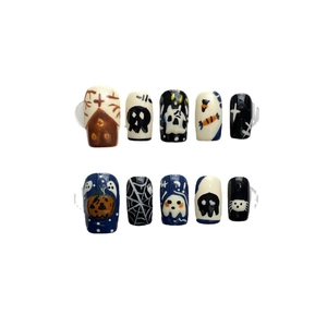 Hand-painted Halloween press-on nails featuring pumpkin, ghost, and spider web patterns
