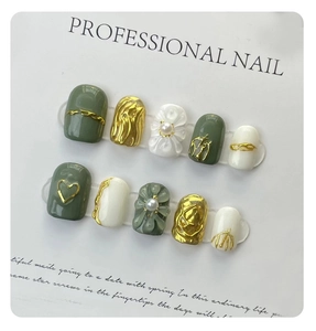 Exquisite handmade press-on nails featuring dark green relief flowers and gold accents