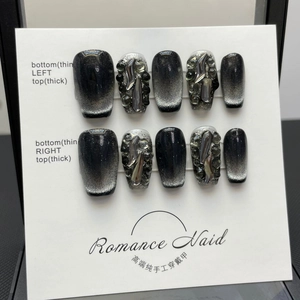 Handmade black cat-eye press-on nails with 3D silver fluid metal accents and glitter