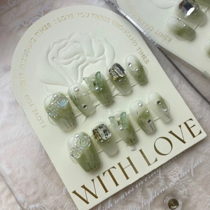 Handmade green and white gradient press-on nails with 3D flower and butterfly accents
