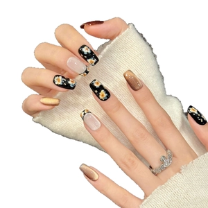 Handmade press-on nails with retro gold flowers and brown cat-eye design