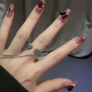 Dark red gradient press-on nails with 3D roses, black butterflies, and pearls