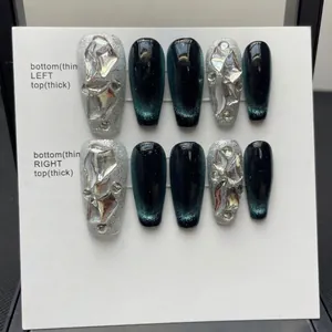Deep green cat-eye press-on nails set with large 3D clear gems and silver glitter