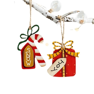 Wooden Christmas ornaments set featuring festive Snow and Joy tags on white branches