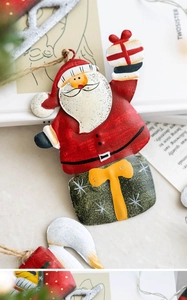 Detailed view of hand-painted Santa Claus iron ornament with natural jute rope hanger