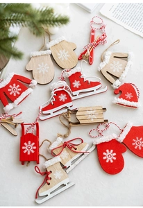 Detail of Nordic wooden Christmas pendants with snowflake patterns and red cotton ropes