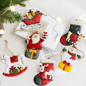 Set of 6 vintage metal Christmas ornaments with Santa Snowman and Deer on warm background