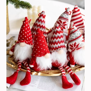 Christmas knit gnomes set with red and white Nordic patterns on a gold vintage tray