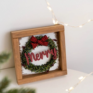 Wooden Merry Christmas sign with green wreath and buffalo plaid bow decoration