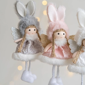 Three plush angel girl ornaments in pink, white, and grey with sequin wings for Christmas decor