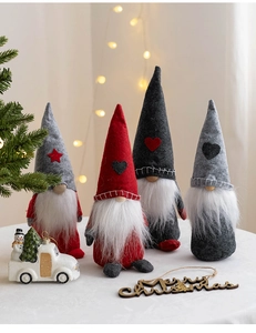 Detail of four handmade Christmas gnomes with pointed hats and white beards for home decor