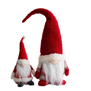 Set of two red and white Christmas gnomes with knit patterns and white fuzzy beards