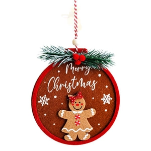 Felt gingerbread man Christmas ornament with pine needles and Merry Christmas text