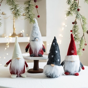 Set of four Christmas Gnomes plush figurines with red and grey hats for holiday decor