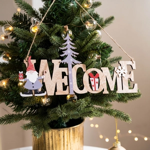 Wooden Christmas Welcome hanging sign with Santa and snowflakes on a lighted tree branch