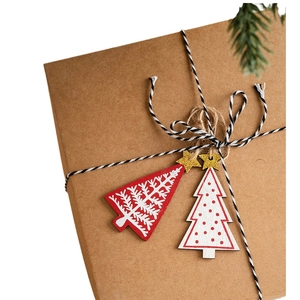 Nordic wooden Christmas tree ornaments with red and white festive designs and gold stars