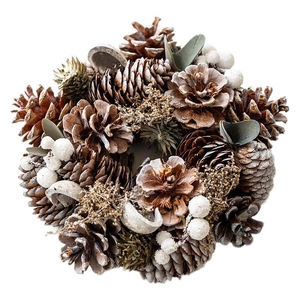 Rustic pine cone wreath with white berries and dried leaves for Christmas table decor