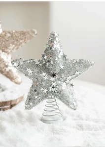 Detail of silver glitter Christmas tree topper star with spring base and mini star accents