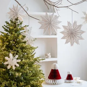 Nordic Christmas tree ornaments set with white paper snowflakes and red honeycomb hats