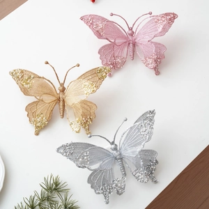 Glittery Christmas butterfly ornaments in pink, gold, and silver with mesh and pearls