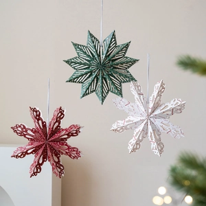 Nordic Christmas 3D hollow star paper ornaments in red, green, and white colors