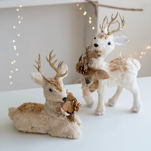 White and gold glitter reindeer Christmas figurines set with pine cone decorations