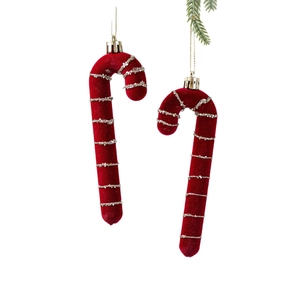 Pair of red flocked candy cane Christmas ornaments with glitter stripes on white background