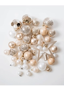 Close-up of champagne gold and pearl white Christmas ornaments with various textures