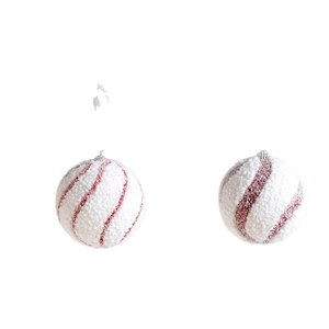 Red and white striped Christmas ball ornaments with snowy velvet texture for holiday decor