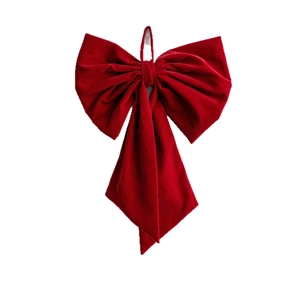 Large burgundy velvet Christmas bow with hanging loop for festive holiday tree decoration
