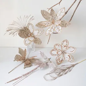 Champagne gold Christmas flower ornaments with glitter butterflies and birds on white background